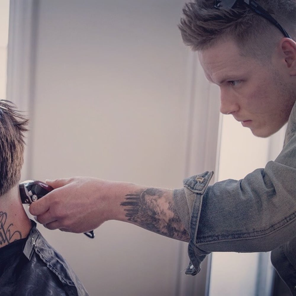 The owner of handcrafted barber lounge-Kory Vaillancourt-Cutting a taper fade